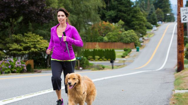 woman running with her dog