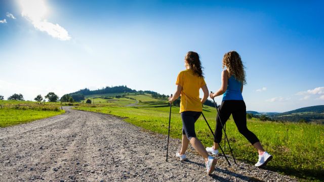 Nordic walking - active people working out outdoor