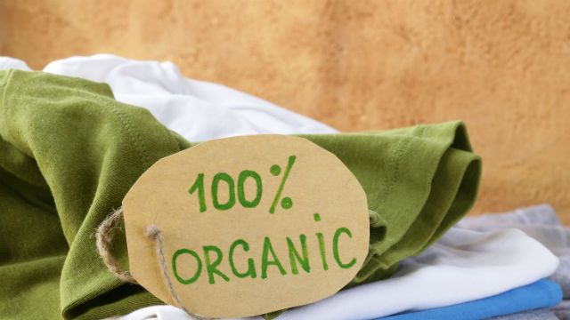 stack of multicolored clothing with organic label