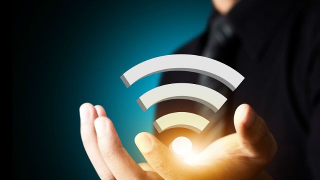 Wifi technology symbol in businessman hand