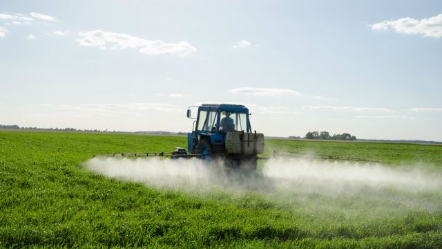 Tractor spray fertilize field pesticide chemical