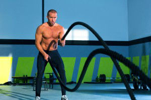 Crossfit battling ropes at gym workout exercise