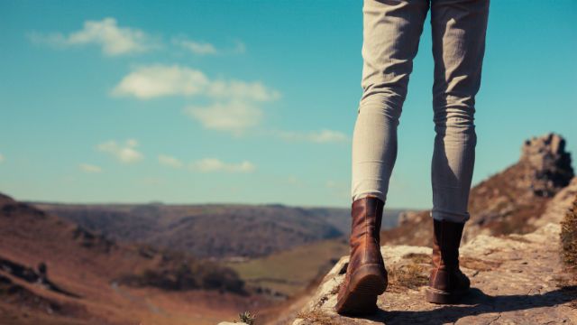 Young woman walking in the mountains