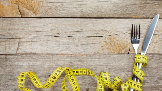 Measure tape with knife and fork. Diet food