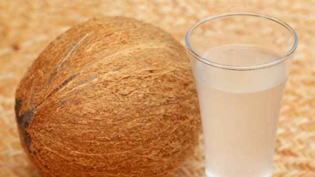 Fresh Coconut with water in a glass