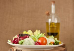 Fresh salad and olive oil