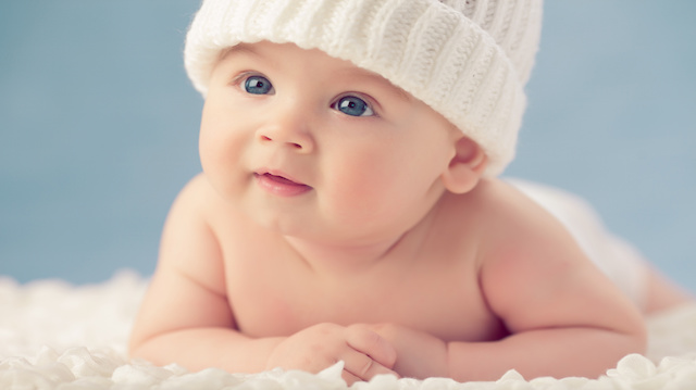Baby in white winter hat