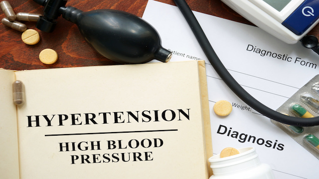High blood pressure   hypertension  written on a book. Medical concept.