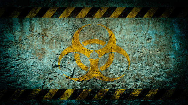 Nuclear radiation warning symbol on grunge wall background