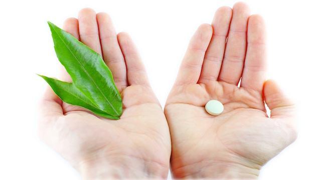 Natural medicines and pills in the hands of