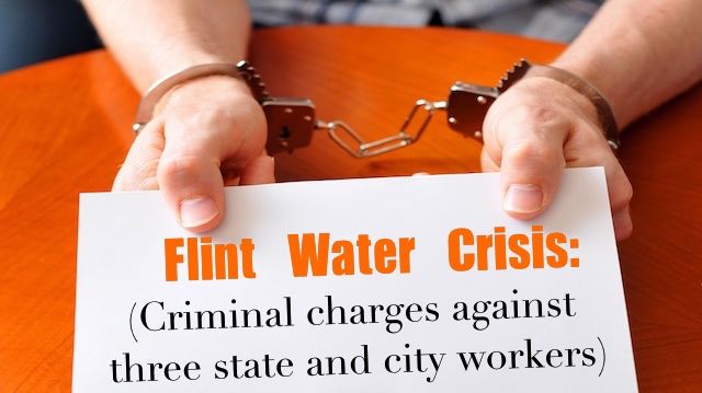 Convict with handcuffs shows blank card