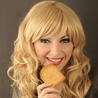 Young woman eating toast