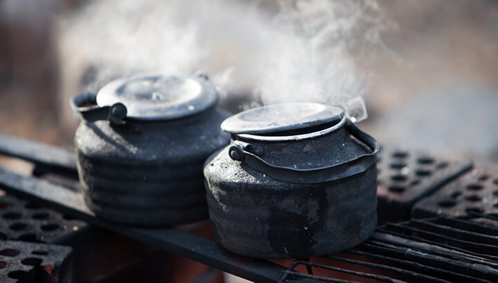 Make saltwater drinkable by using a kettle in the outdoors.