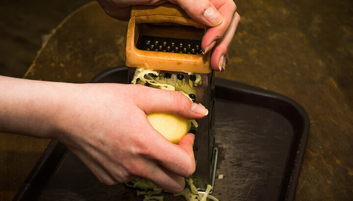 Potatoes can clean out old cheese in a grater.