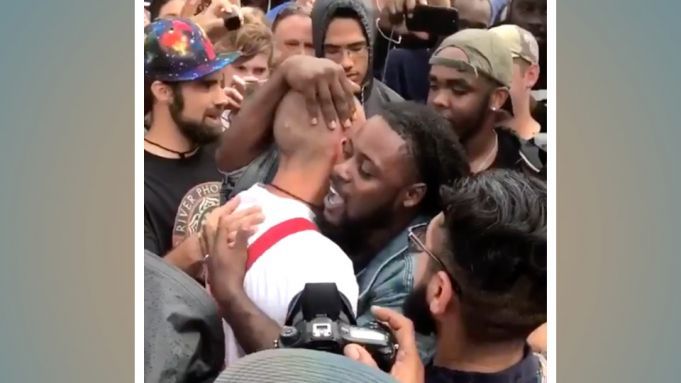 Protestor Hugs CONTROVERSIAL Person He Is Protesting (Watch What Happens Next)